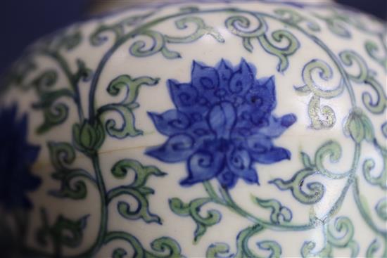 A rare Chinese doucai lotus flower jar, Wanli six character mark and probably of the period, (1573-1619), H. 9.5cm, D. 10.8cm, later